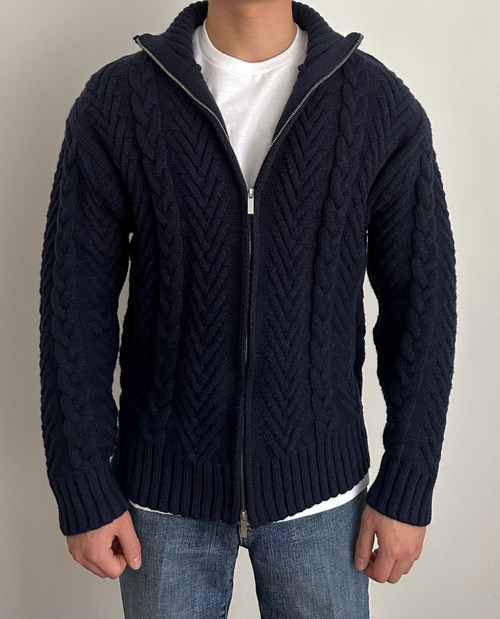 Man wearing the cable knit zip cardigan in navy – front view
