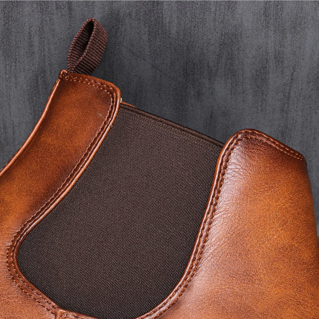 Close-up of the elastic panel on the brown Chelsea boots