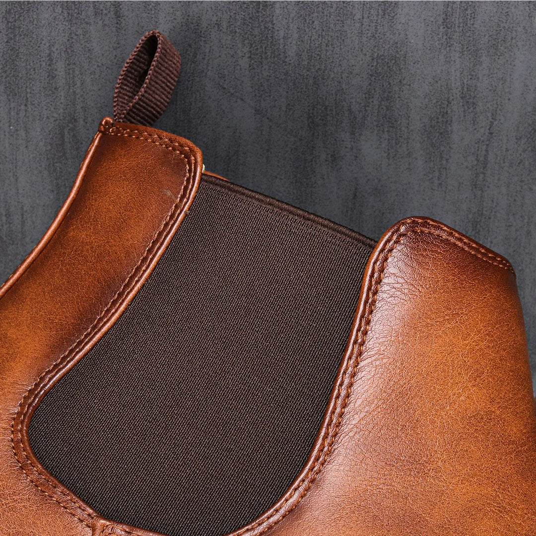 Close-up of the elastic panel on the brown Chelsea boots