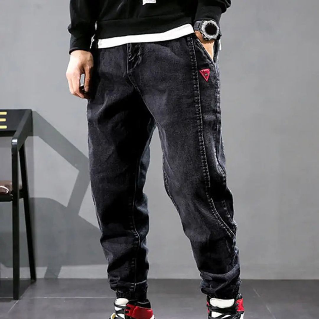Men's denim jogger trousers in black, side view