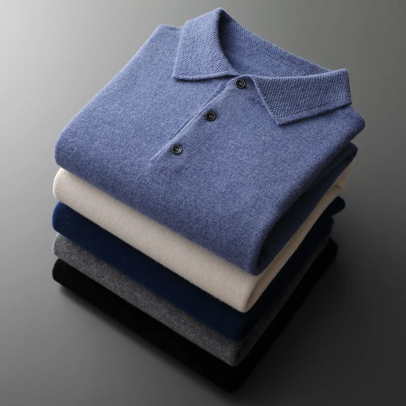 Stack of men's knit polo sweaters in light blue, cream, dark blue and black