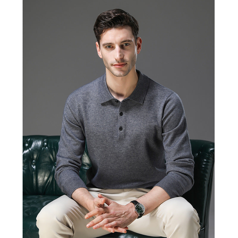 Man seated wearing the knit polo sweater in grey