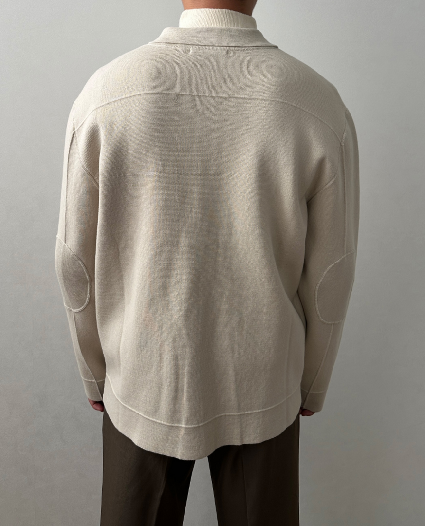 Man wearing the knit zip jacket in beige – back view