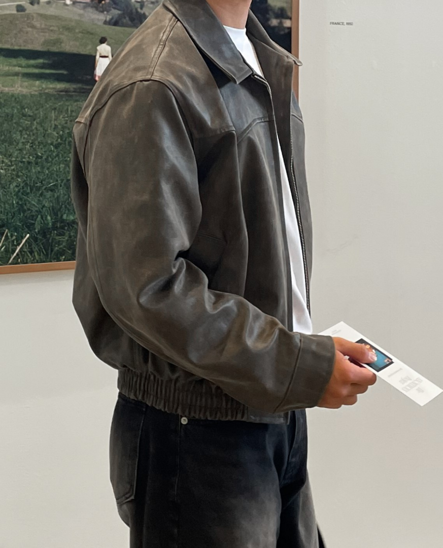 Man wearing the leather-look zip jacket in brown – side view
