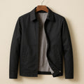 Men's lightweight zip jacket in black – front view on hanger