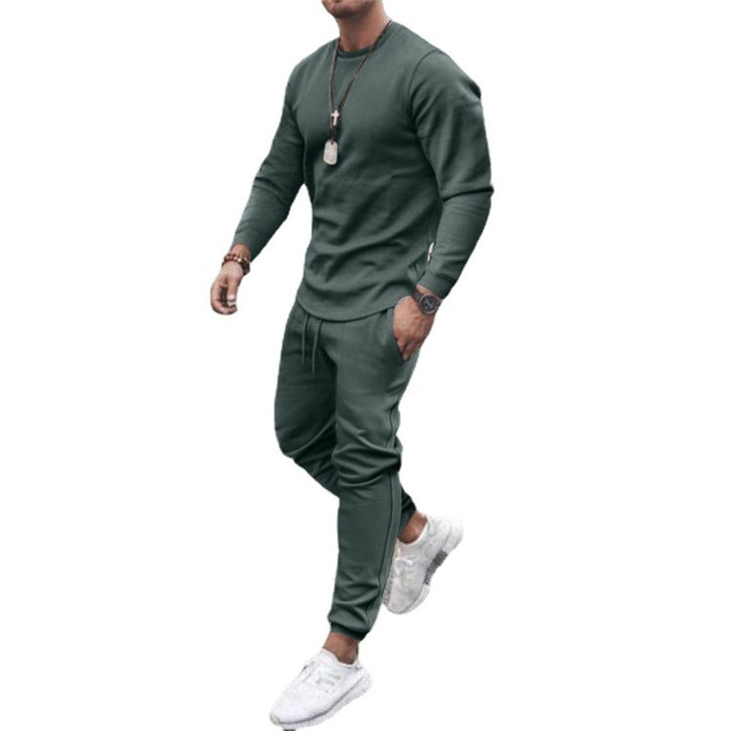 Men's slim fit sweatshirt and jogger set in green, studio view