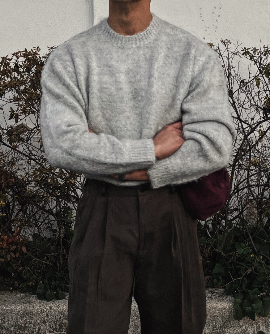 Man wearing the soft knit crew neck sweater in grey – arms crossed