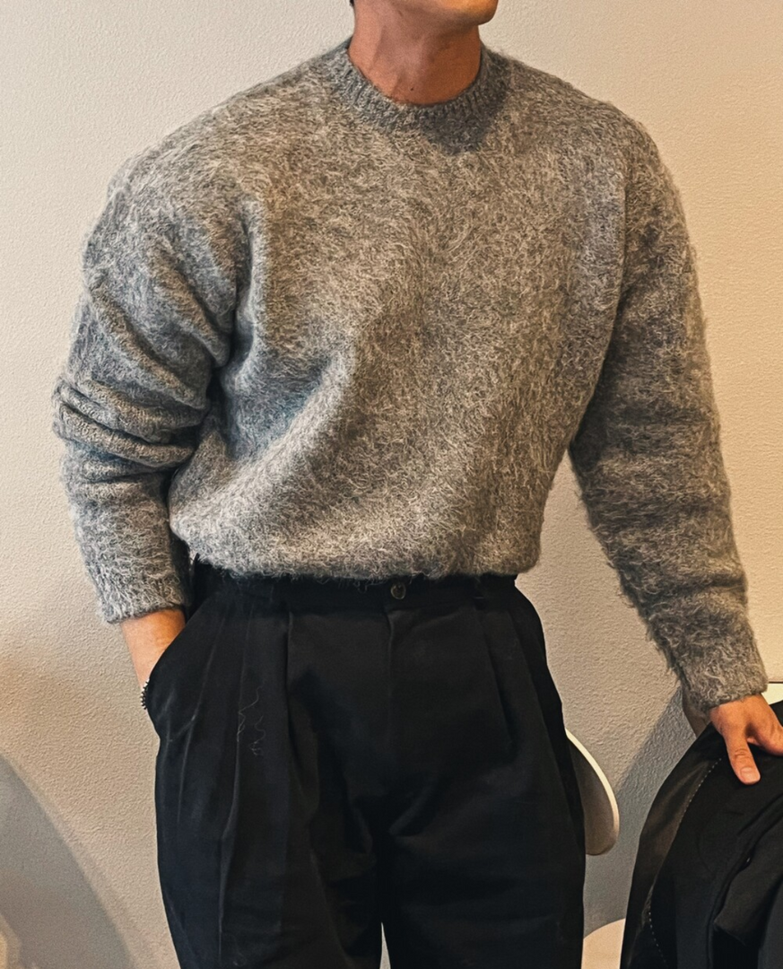 Man wearing the soft knit crew neck sweater in dark grey – front view
