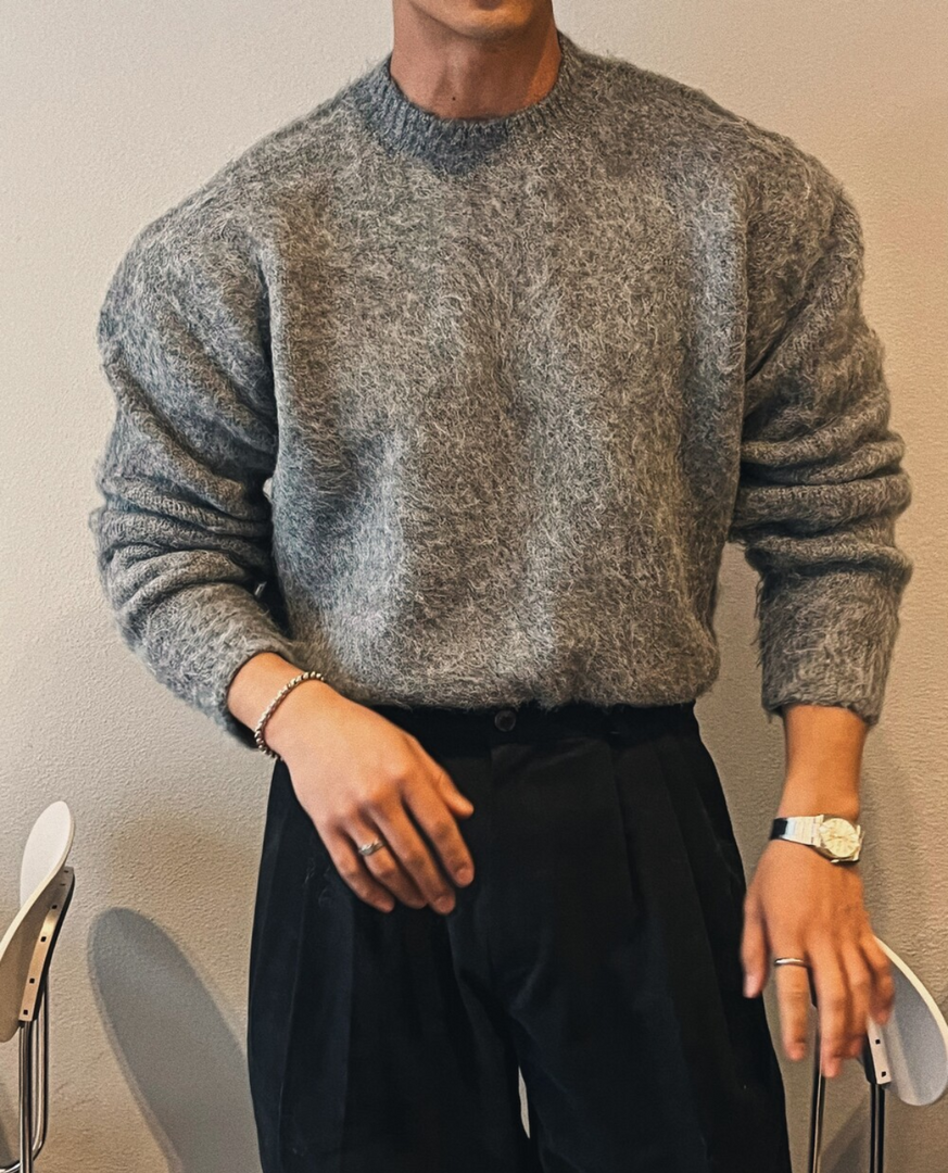 Man wearing the soft knit crew neck sweater in dark grey – relaxed