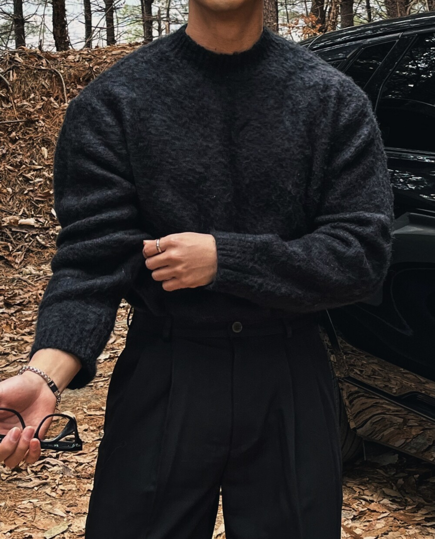 Man wearing the soft knit crew neck sweater in black – relaxed