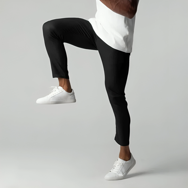 Man wearing the stretch chino trousers in black – stretching