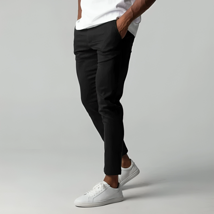 Man wearing the stretch chino trousers in black – side view