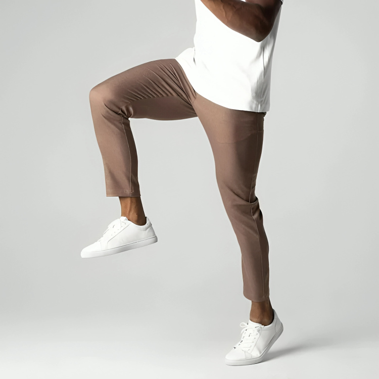 Man wearing the stretch chino trousers in khaki – stretching