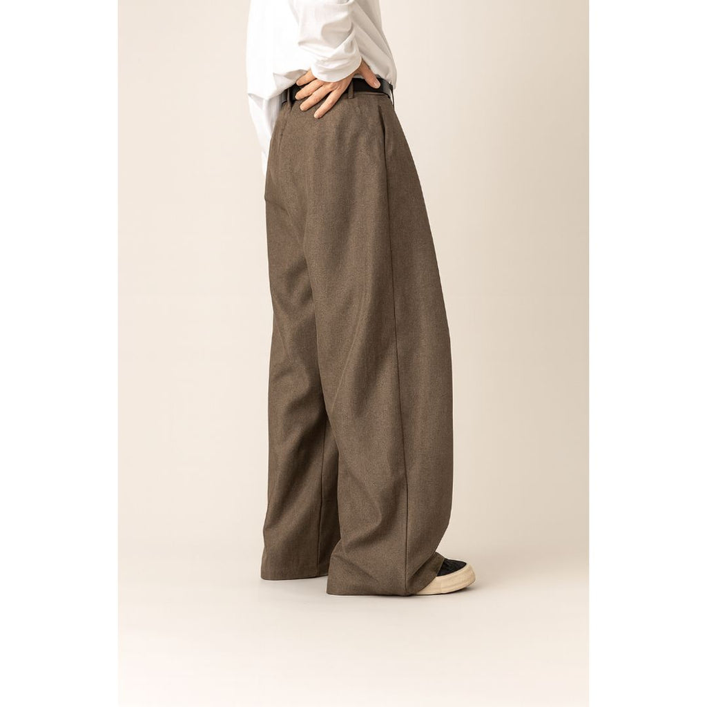 Men's wide leg pleated trousers in light brown, side view