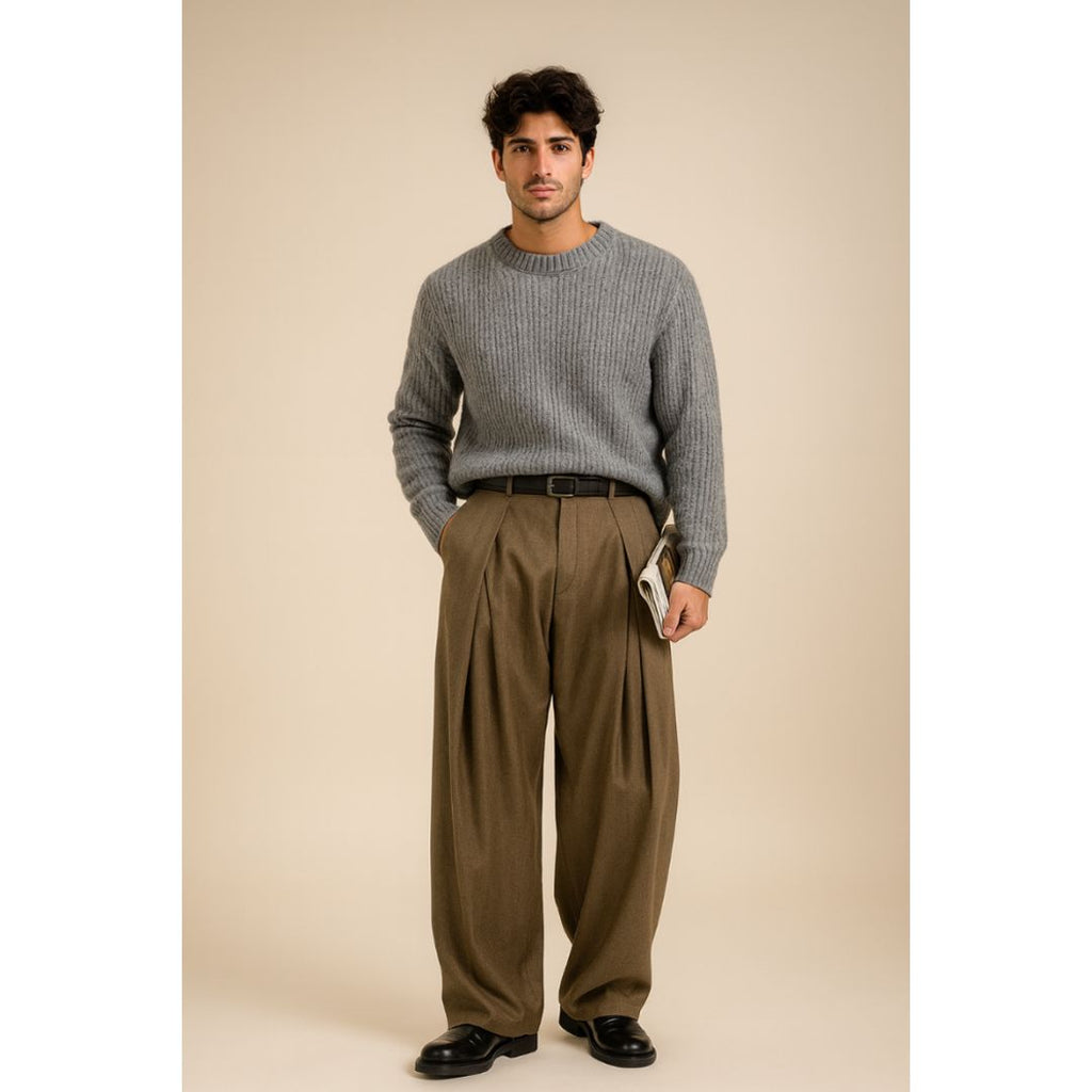 Men's wide leg pleated trousers in light brown, worn with a jumper