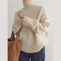 Beige women's relaxed turtleneck sweater