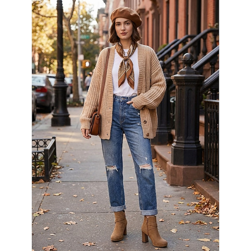 Woman wearing the buckle strap ankle boots in light brown with jeans
