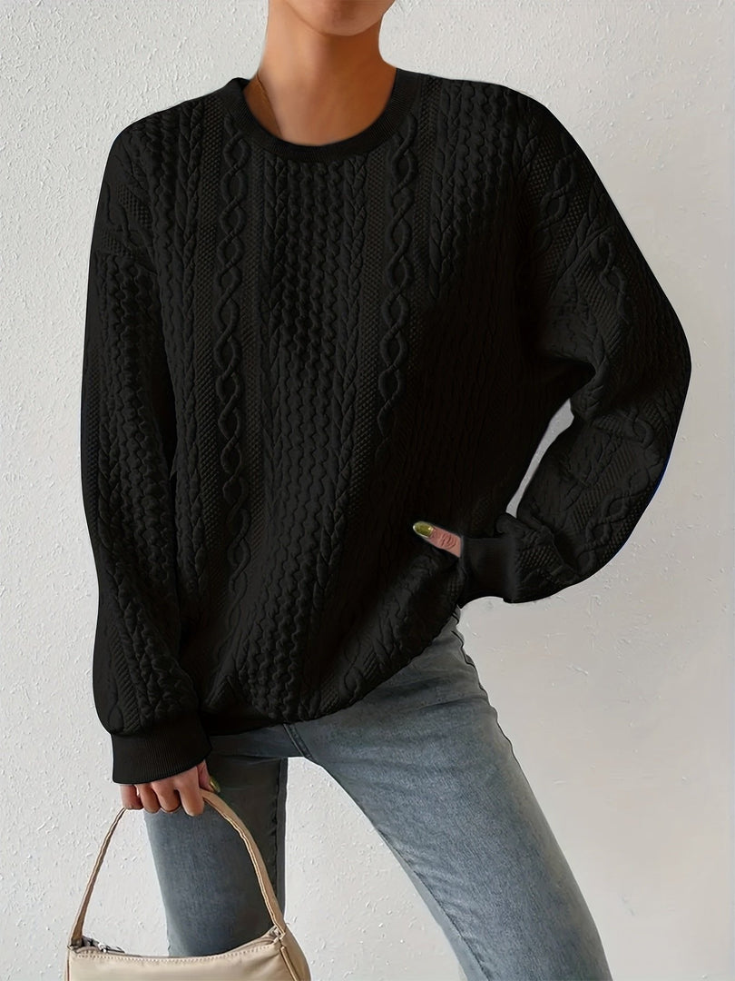 Women's cable knit sweatshirt in black – front view with bag