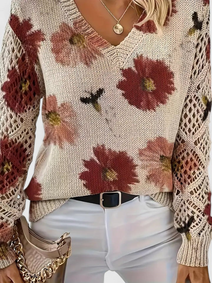 Women's floral openwork knit sweater in red floral – close-up