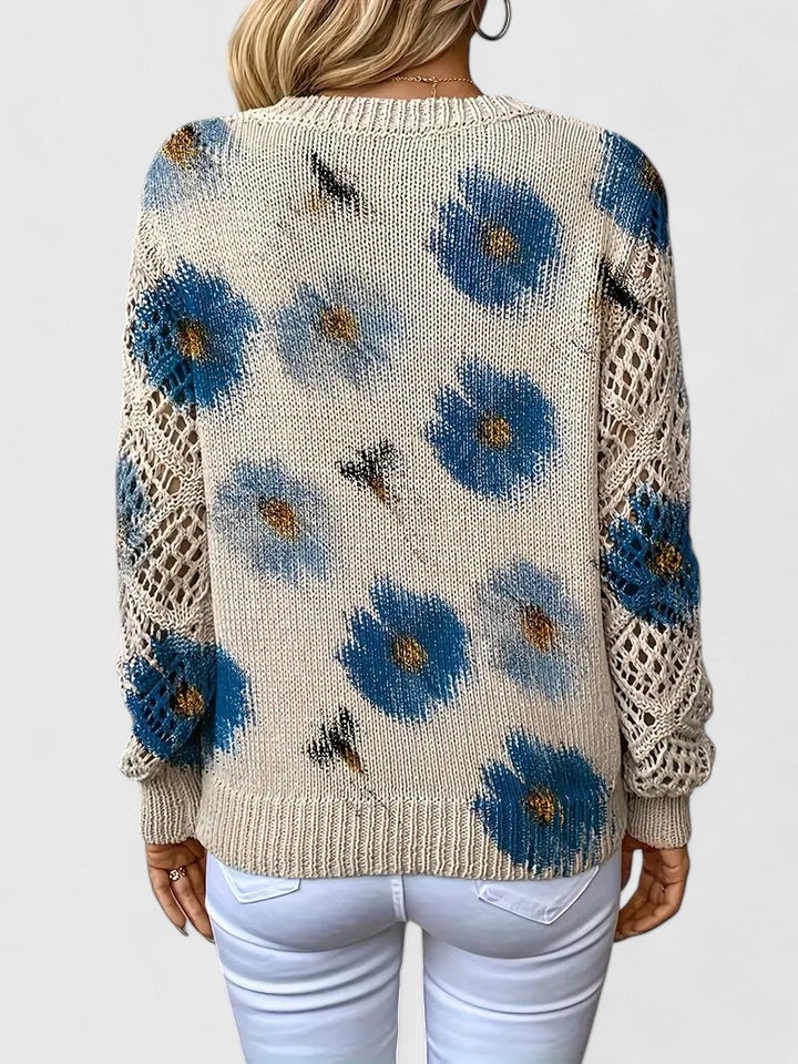 Women's floral openwork knit sweater in blue floral – back view