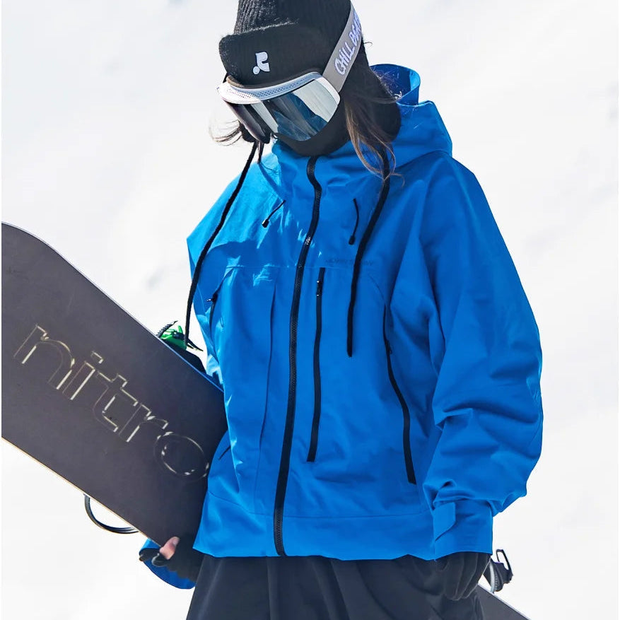 Women's hooded snow jacket in blue – with snowboard