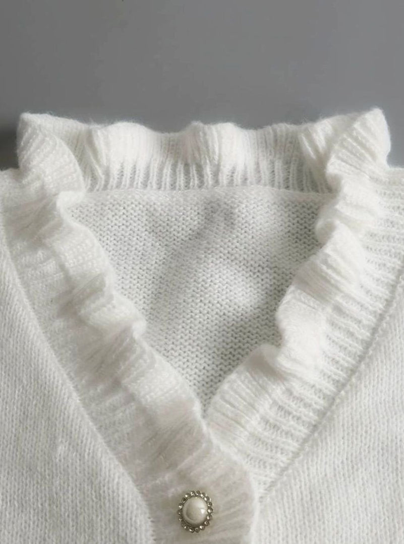 Close-up of the ruffle neckline