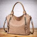 Women's large handbag with decorative zips in taupe