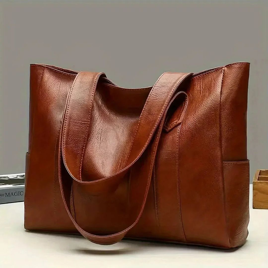Women's large leather look tote bag in brown, on a table