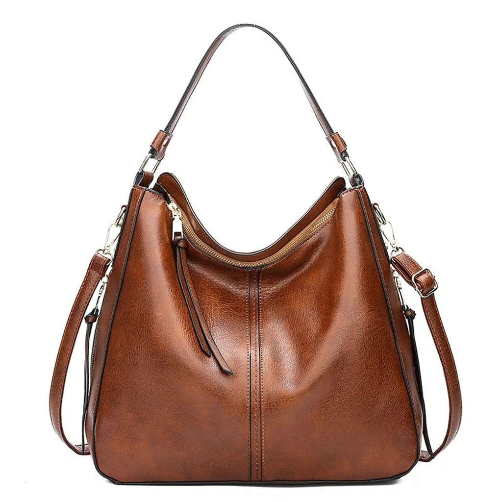Women's leather look hobo bag with side zips in brown