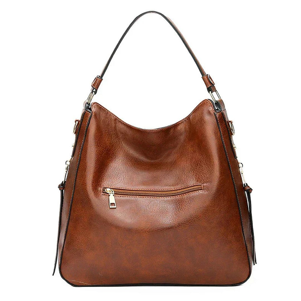 Women's leather look hobo bag with side zips in brown, back view