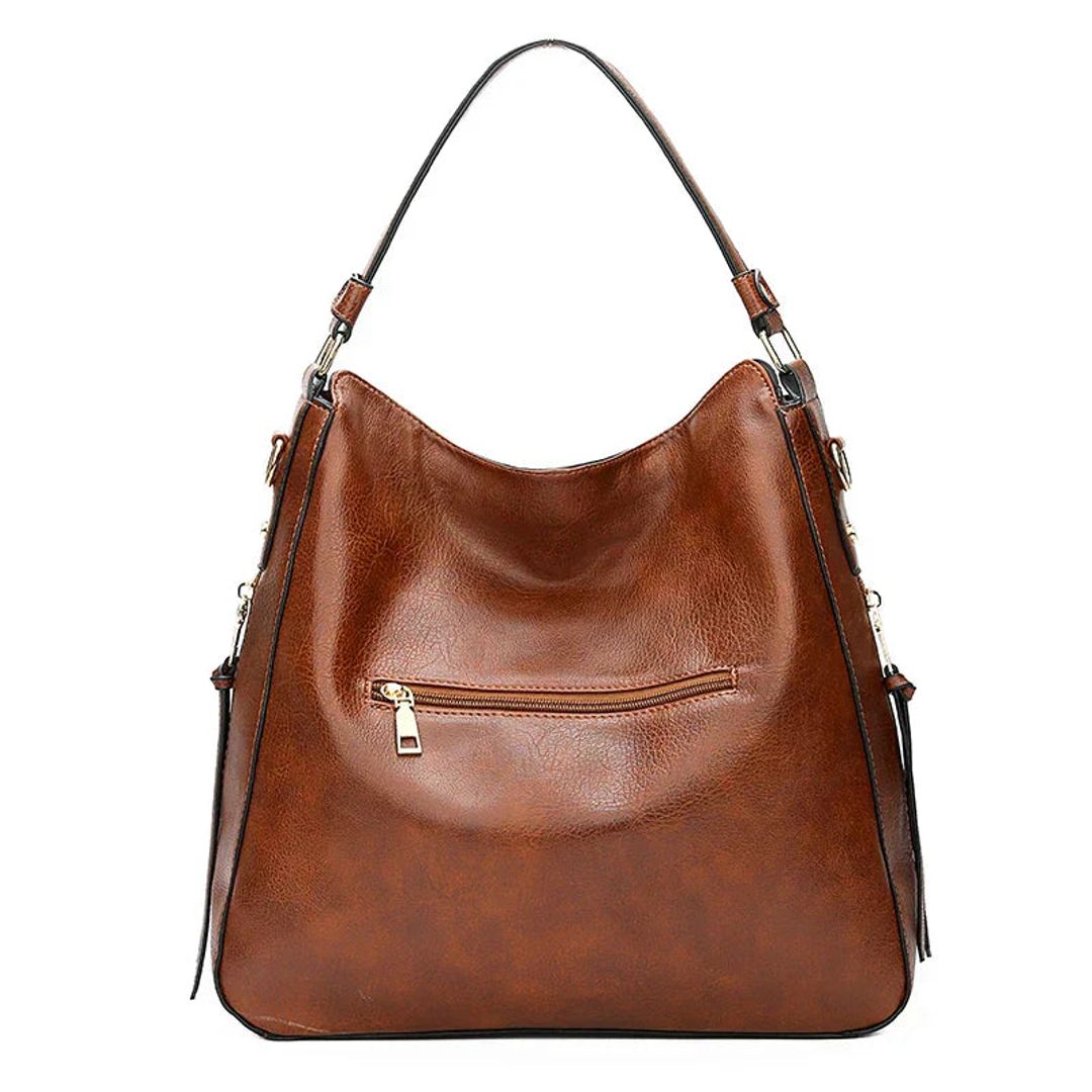 Women's leather look hobo bag with side zips in brown, back view