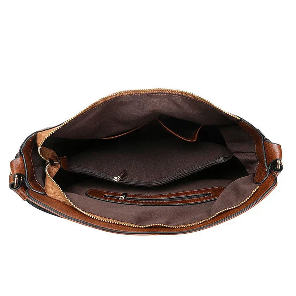 Women's leather look hobo bag with side zips in brown, inside view