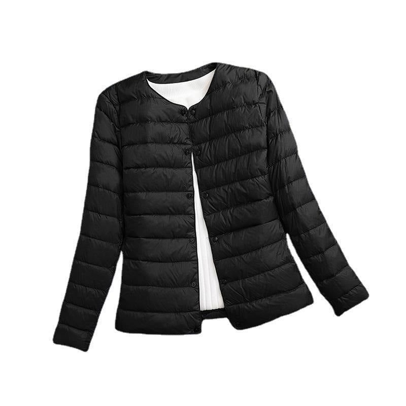 Women's lightweight quilted jacket in black – flat view