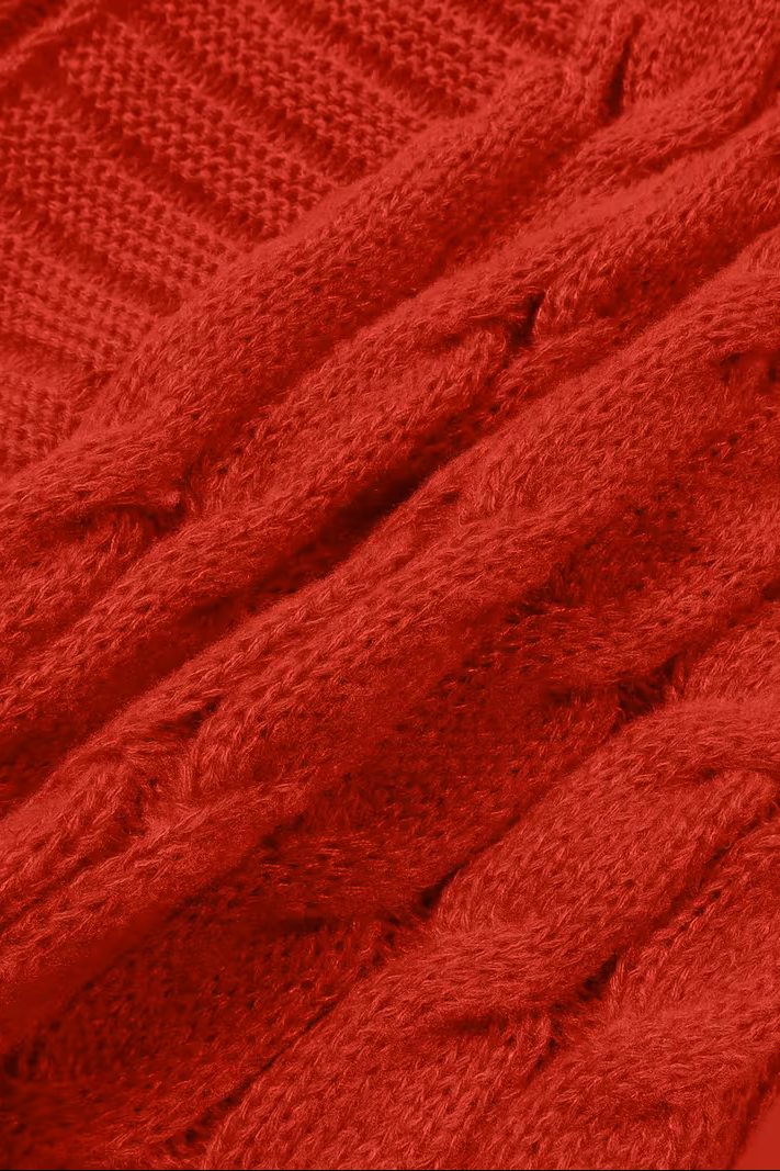 Close-up of the cable knit on the red cardigan