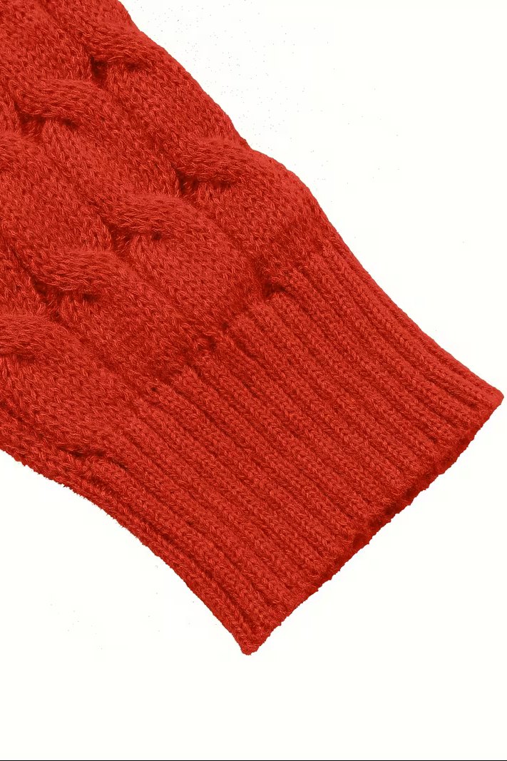Close-up of the ribbed cuff on the red cardigan