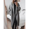 Women's long winter coat with lapels in grey – styled look