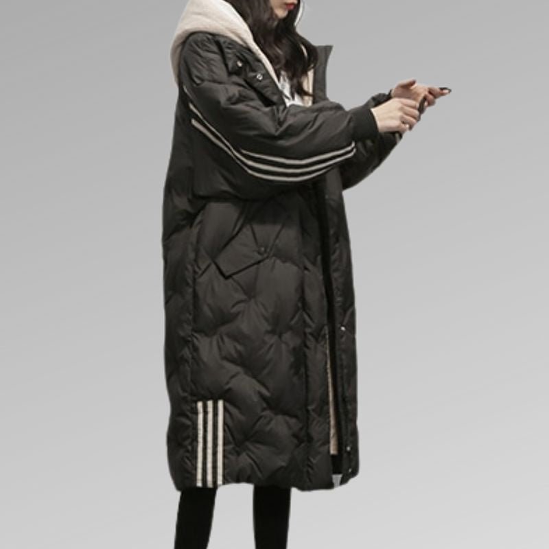 Women's long stripe detail quilted coat in black – side view