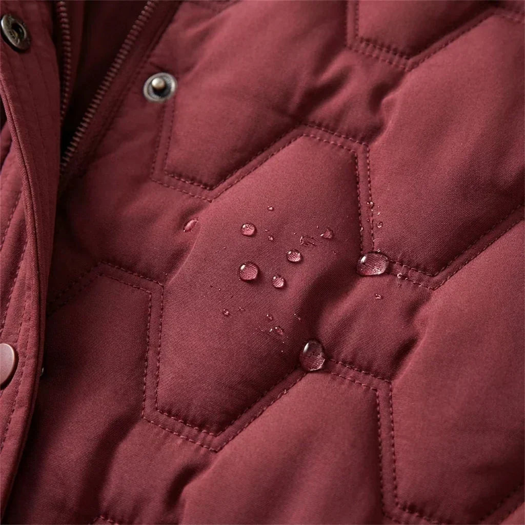 Close-up of the red quilting with water drops