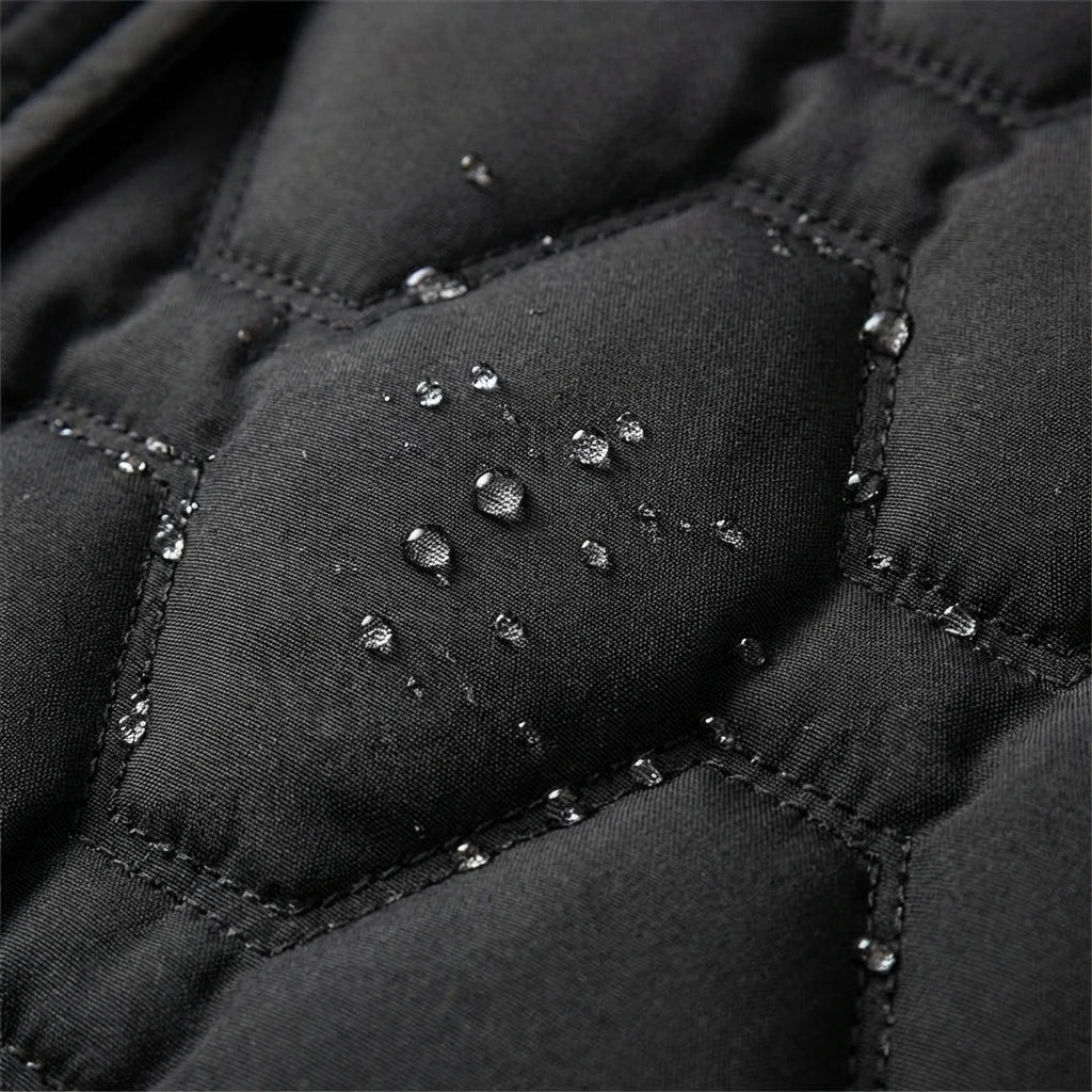 Close-up of the black quilting with water drops