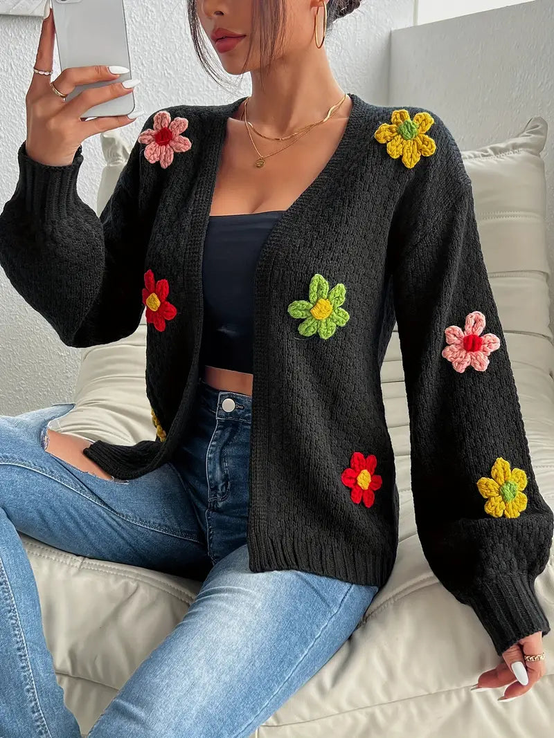 Women's flower appliqué cardigan in black – seated