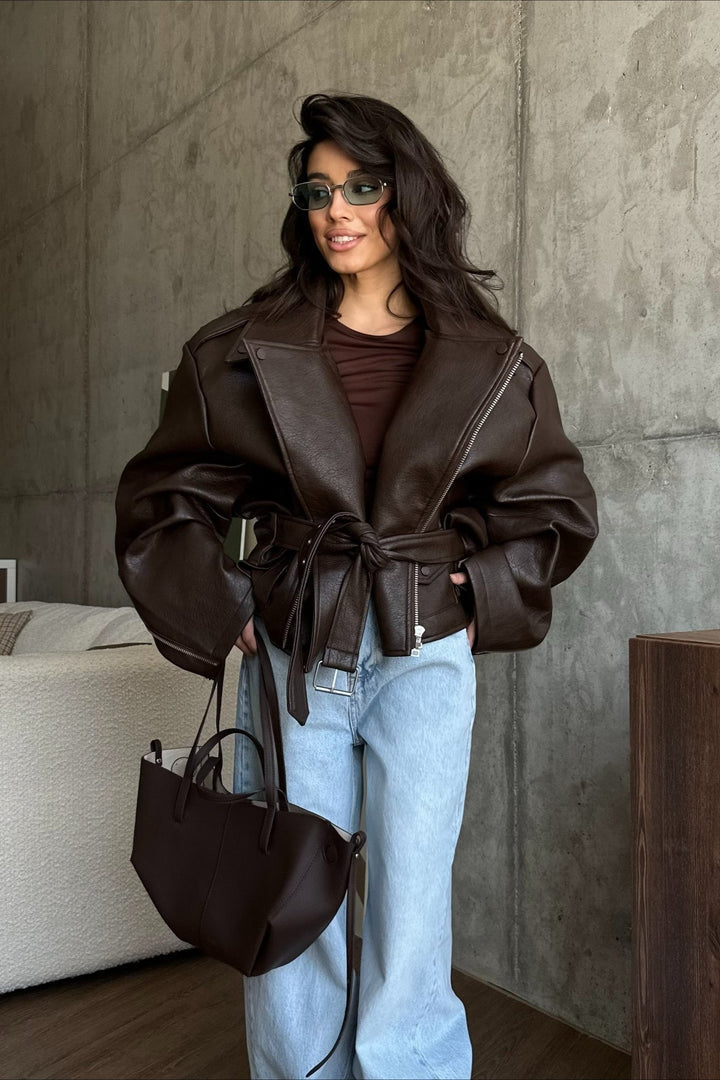 Women's leather-look belted bomber jacket in dark brown – seated