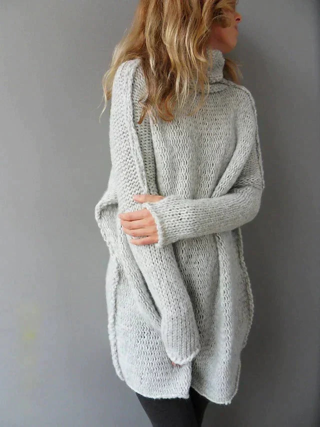 Women's oversized turtleneck knit sweater in light grey – side view