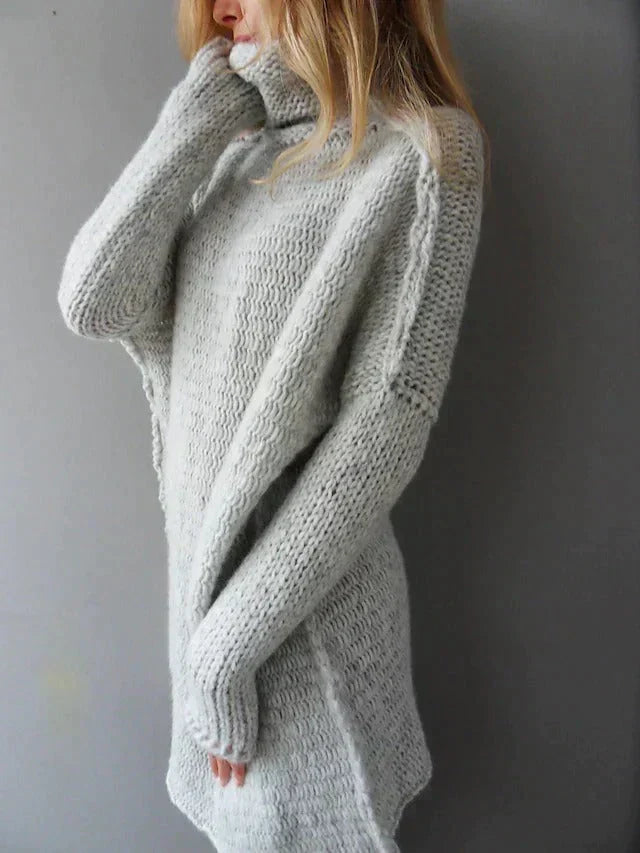 Women's oversized turtleneck knit sweater in light grey – three-quarter view