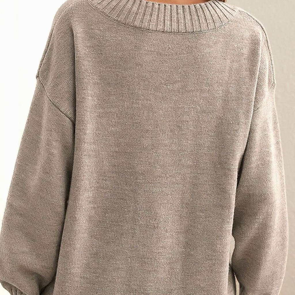 Women's oversized V-neck knit sweater in beige – laid flat