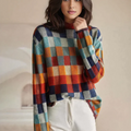 Women's patchwork check knit sweater in orange, blue and teal – front view