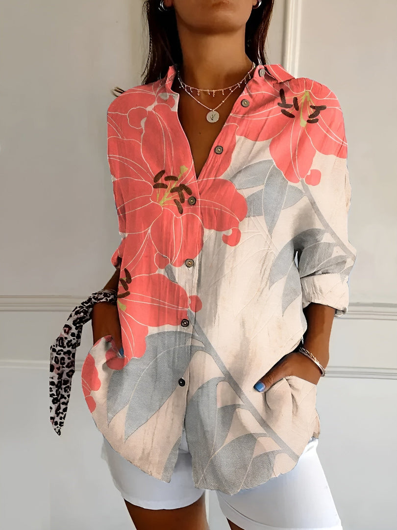 Women's printed button-up blouse in coral leaf – front view