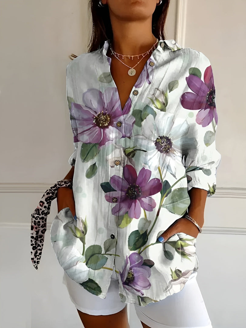 Women's printed button-up blouse in lilac floral – front view