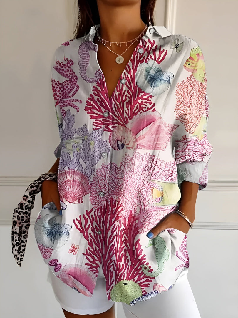 Women's printed button-up blouse in pink coral – front view