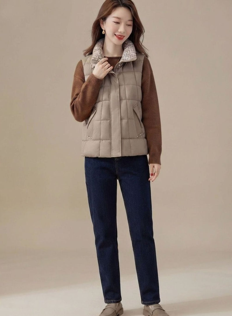 Women's high collar quilted gilet in apricot – worn over a brown knit