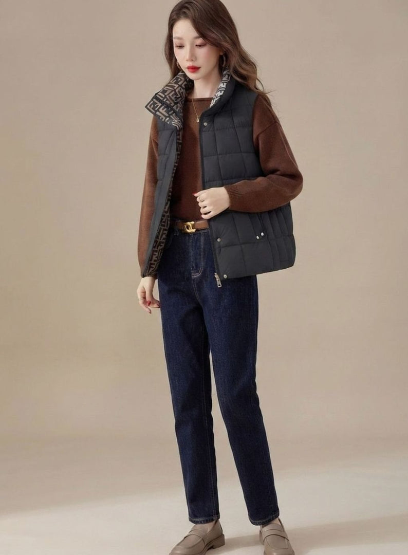 Women's high collar quilted gilet in black – front view